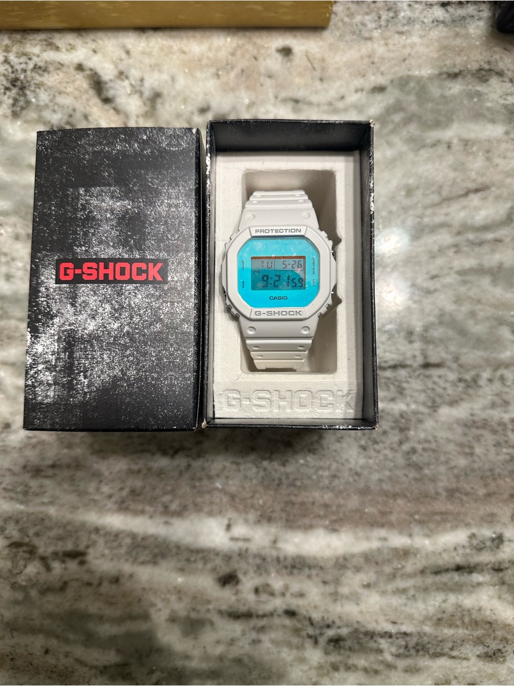 G-Shock White Watch with Aqua Blue Dial